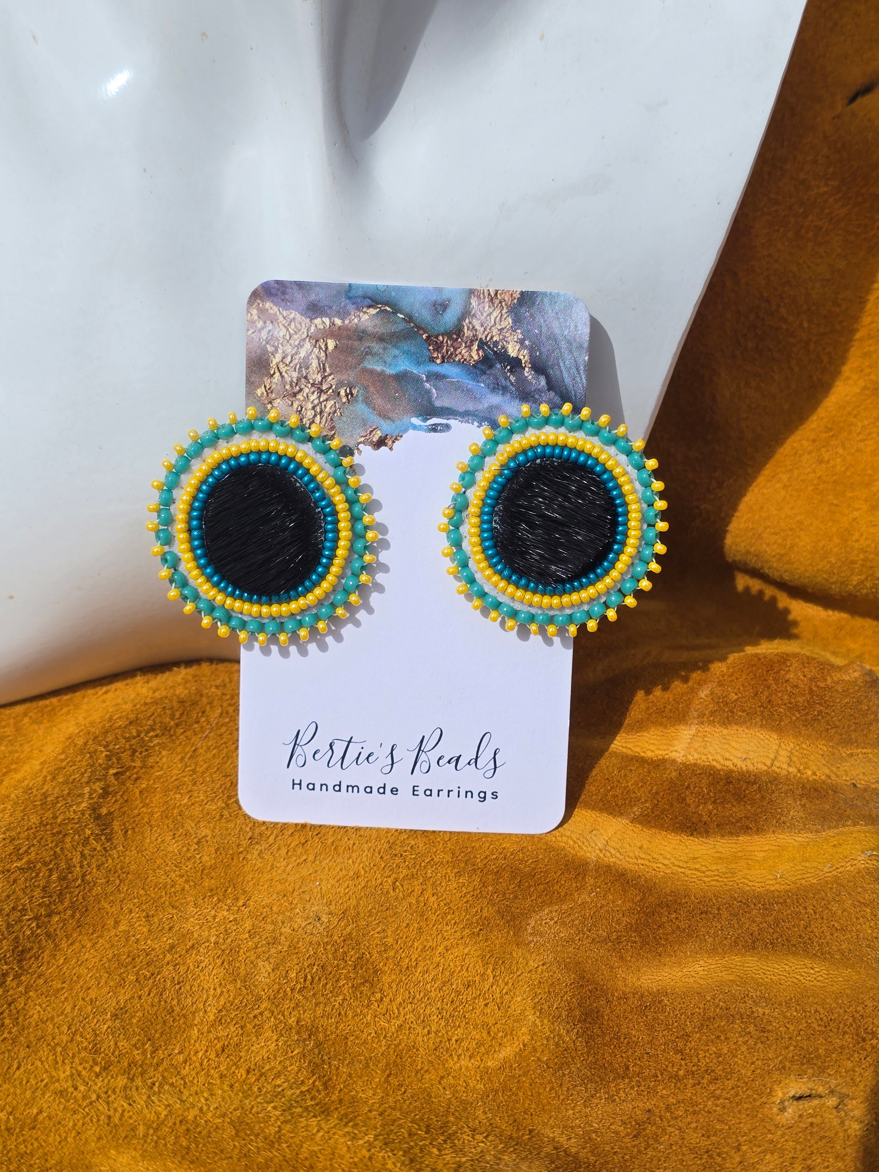 Studded seal fur earrings